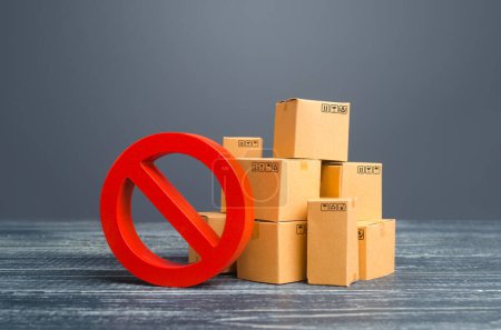 Cardboard boxes and red prohibition symbol NO. Restriction on import, ban on export of dual-use goods to countries under sanctions. Out of stock. Embargo trade wars. Overproduction or scarcity