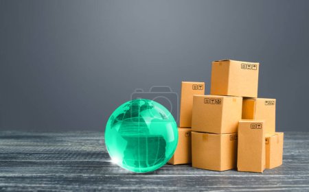 Photo for Light green globe and cardboard boxes. Economic relations commerce. Freight transportation. Distribution and trade exchange goods around the world, retail and sales. Global business, import, export - Royalty Free Image