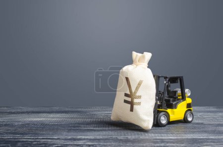 Photo for Yellow forklift carries a Yen yuan money bag. Big contract, profitable deposit, take a loan. Payment of taxes. Inflation, price increases. Wealth, big investments in economy. Grants, project financing - Royalty Free Image
