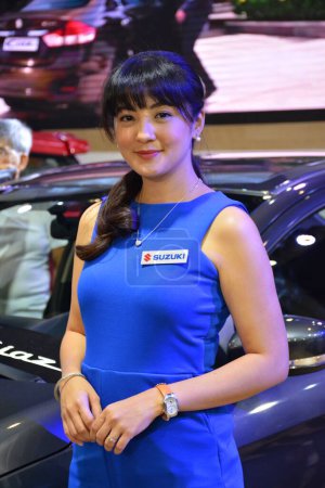 Photo for "Suzuki female model at Manila International Auto Show in Pasay - Royalty Free Image
