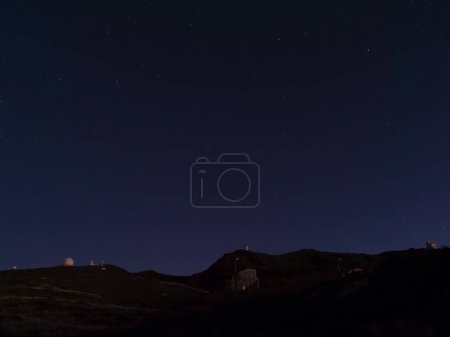 Photo for Night astrophotography, sky with stars at Roque de los Muchachos with telescopes of astronomical observatory, la Palma, Canary islands, Spain - Royalty Free Image