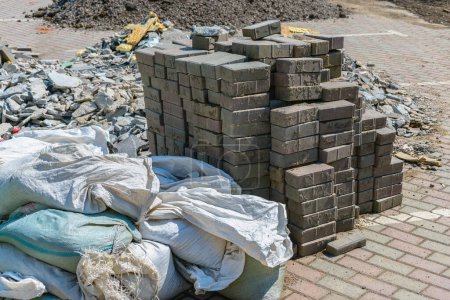 Photo for Construction waste in bags, broken stone and a pile of bricks during industrial work - Royalty Free Image