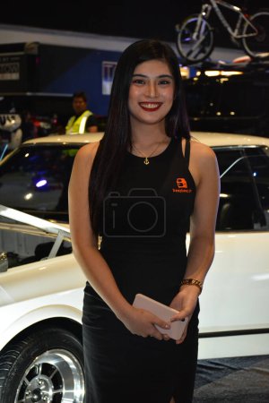 Photo for "female model at Bumper to Bumper prime car show in Pasay - Royalty Free Image