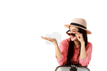 Photo for Asian women long hair wear hat and sunglasses  with travel bag - Royalty Free Image