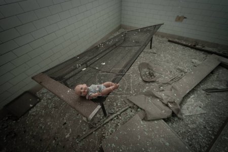 Photo for A vintage doll abandoned in the rooms of an abandoned psychiatric hospital - Royalty Free Image