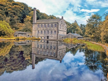 Photo for Gibson mill a water powered mill with main building reflected in the water - Royalty Free Image