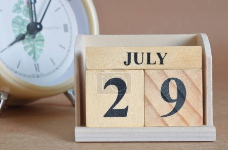 Photo for Wooden calendar with month of July - Royalty Free Image