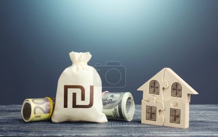 Photo for Israeli shekel money bag and puzzle house. Housing cooperative membership. Mortgage loan on purchase, building maintenance and utility services costs. Property valuation. State social programs. - Royalty Free Image