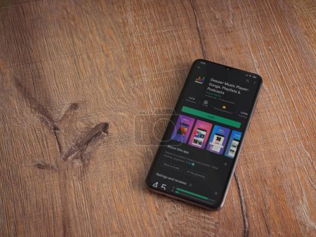 Photo for "Deezer Music Player app play store page on the display of a blac" - Royalty Free Image