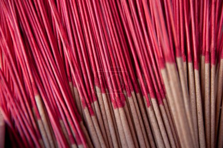 Photo for Red classical old incense joss sticks in group at Asian temple - Royalty Free Image