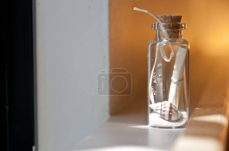 Photo for Message in a bottle of sand and shell - Royalty Free Image