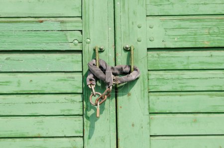 Photo for Green door with lock, close up - Royalty Free Image