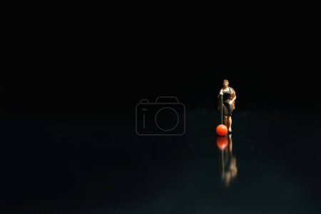 Photo for Miniature photography - elegant women singer singing on shiny black stage with reflection - Royalty Free Image