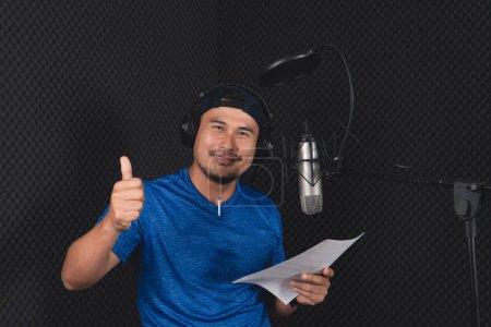 Photo for Artist practiced singing in the recording studio. - Royalty Free Image