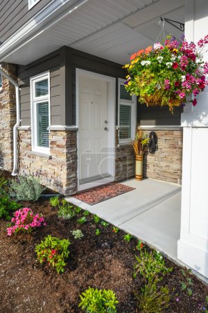Photo for Entrance of brand new townhome decorated with flowers - Royalty Free Image