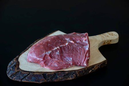 Photo for Raw meat on board, close up - Royalty Free Image