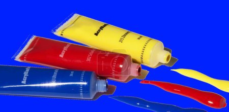 Foto de Tubos de pintura akrill amarillos, rojos y azules con fondo azul - Imagen libre de derechos