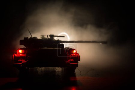 Photo for War Concept. Military silhouettes fighting scene on war fog sky background, World War German Tanks Silhouettes Below Cloudy Skyline At night. Attack scene. Armored vehicles. Tanks battle - Royalty Free Image