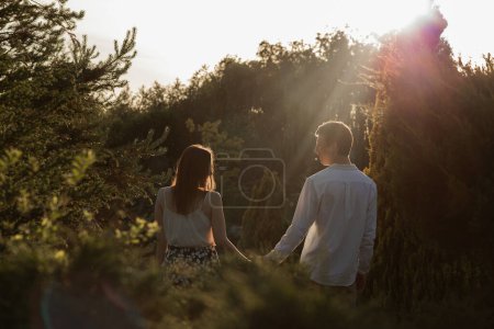 Photo for The young couple walking in the park - Royalty Free Image