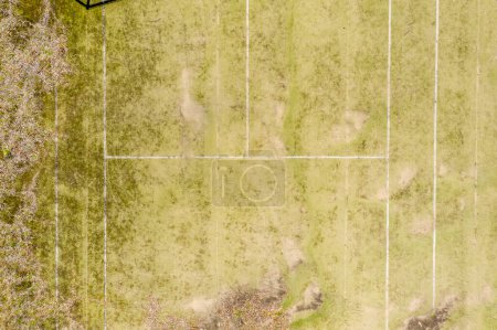 Photo for An old unused tennis court in a public park in a small town - Royalty Free Image