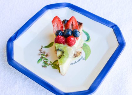 Photo for Close-up shot of delicious cheese cake with fruits - Royalty Free Image