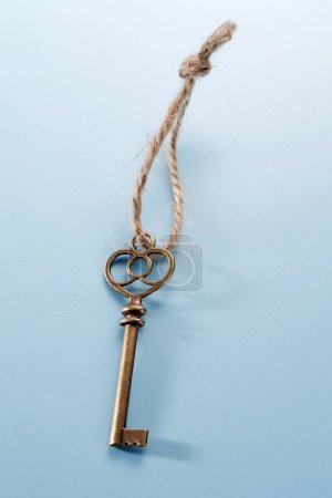 Photo for Vintage key on blue background - Royalty Free Image
