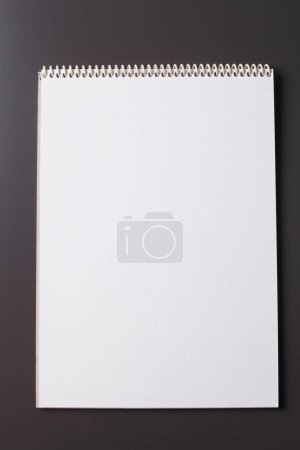 Photo for White notapad on dark background - Royalty Free Image