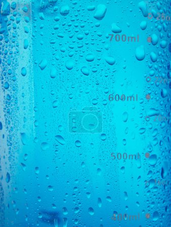 Photo for Blue water bottle with small drops on surface - Royalty Free Image