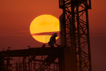 Photo for Silhouette of a construction worker at work - Royalty Free Image