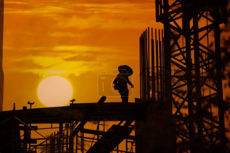 Photo for Silhouette of a man on construction site - Royalty Free Image