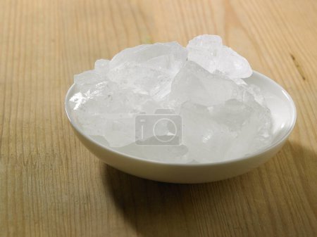 Photo for Bowl of sea salt on white background - Royalty Free Image