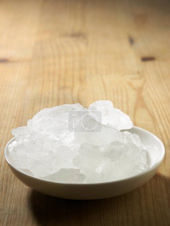 Photo for Bowl with ice on wooden table - Royalty Free Image