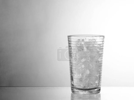 Photo for Glass of ice on grey background - Royalty Free Image