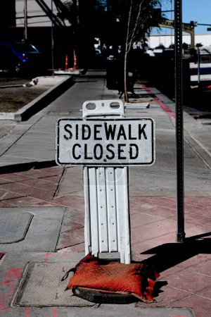 Photo for Sidewalk closed sign board.closing a sidewalk - Royalty Free Image