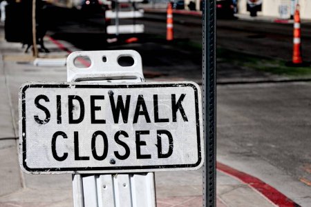 Photo for Sidewalk closed sign board.closing a sidewalk - Royalty Free Image