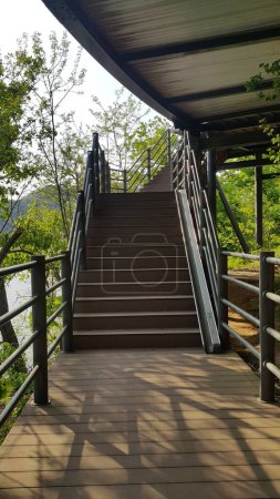 Photo for Wooden stairs with handrails on both sides - Royalty Free Image