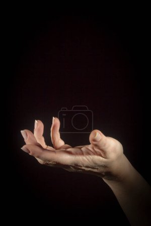 Photo for Open hand gesture on black - Royalty Free Image