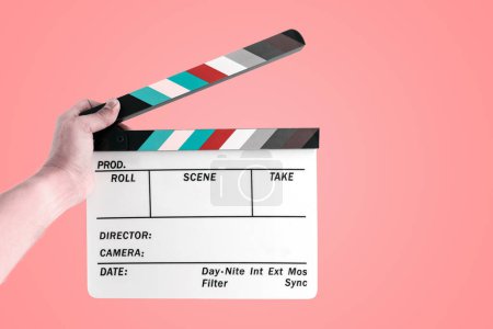 Photo for Cinema film slate in hand. - Royalty Free Image