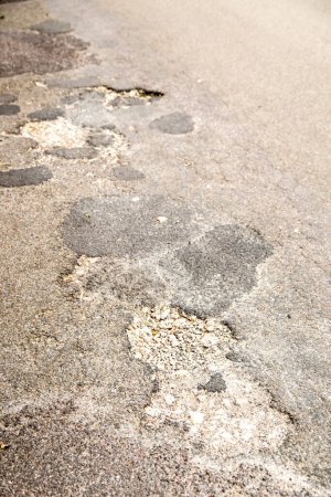 Photo for Damaged street asphalt background - Royalty Free Image