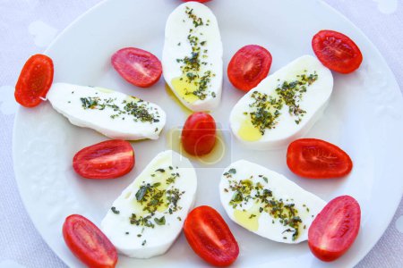 Photo for Mozzarella with cherry tomatoes and oil - Royalty Free Image