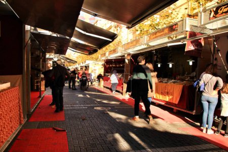 Photo for "People walking and buying nougat in Jijona" - Royalty Free Image
