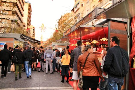Photo for "People walking and buying nougat in Jijona" - Royalty Free Image