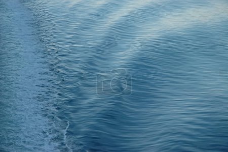 Photo for White backwash of a ferry crossing blue ocean - Royalty Free Image