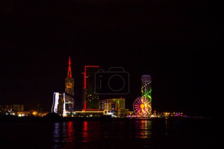 Téléchargez les photos : Batumi at night city view, skyscrapers and towers. City view at night. - en image libre de droit