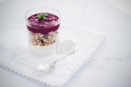 Photo for Homemade granola parfait with berry jam and mint, yogurt and muesli - Royalty Free Image