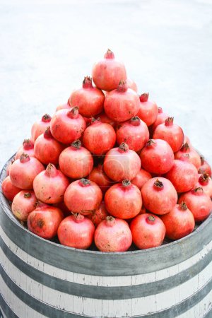 Photo for Pomegranates pile isolated on white - Royalty Free Image