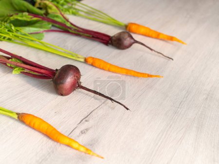 Photo for Fresh beautiful washed beets and carrots. layout, top view - Royalty Free Image