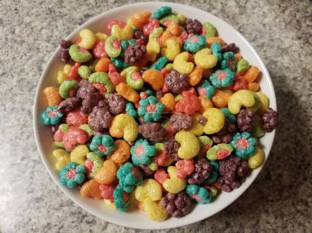 Photo for Bowl of colorful fruit cereal on counter - Royalty Free Image