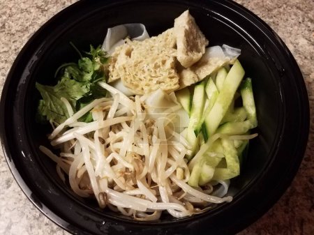 Photo for Bowl of tofu and noodles and vegetables - Royalty Free Image