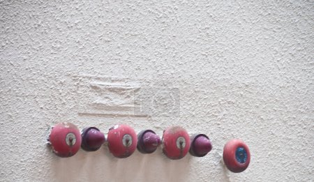 Photo for Many red fire alarm bells attached to a building wall - Royalty Free Image